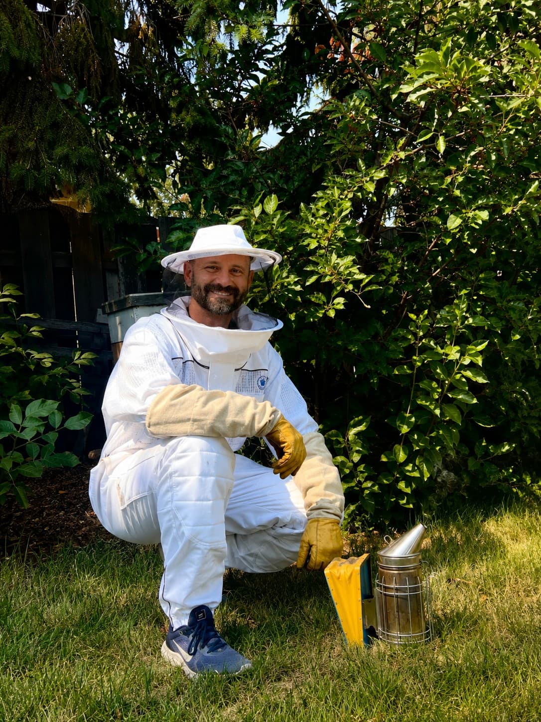 Adam LeClaire in his beekeeping suit